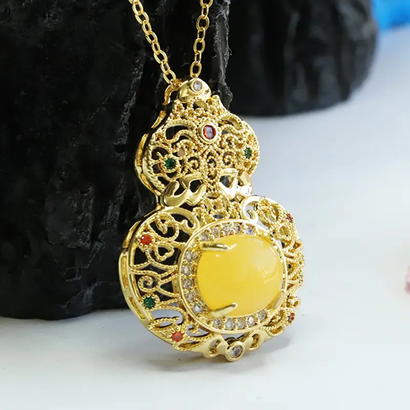 Ethnic Gold Pendant Necklace with Yellow Amber Gourd Design