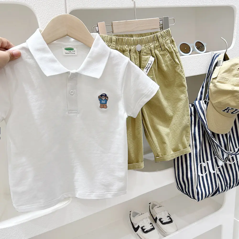 Boys White Polo Shirt with Cartoon Logo Medium to XL - Image 4
