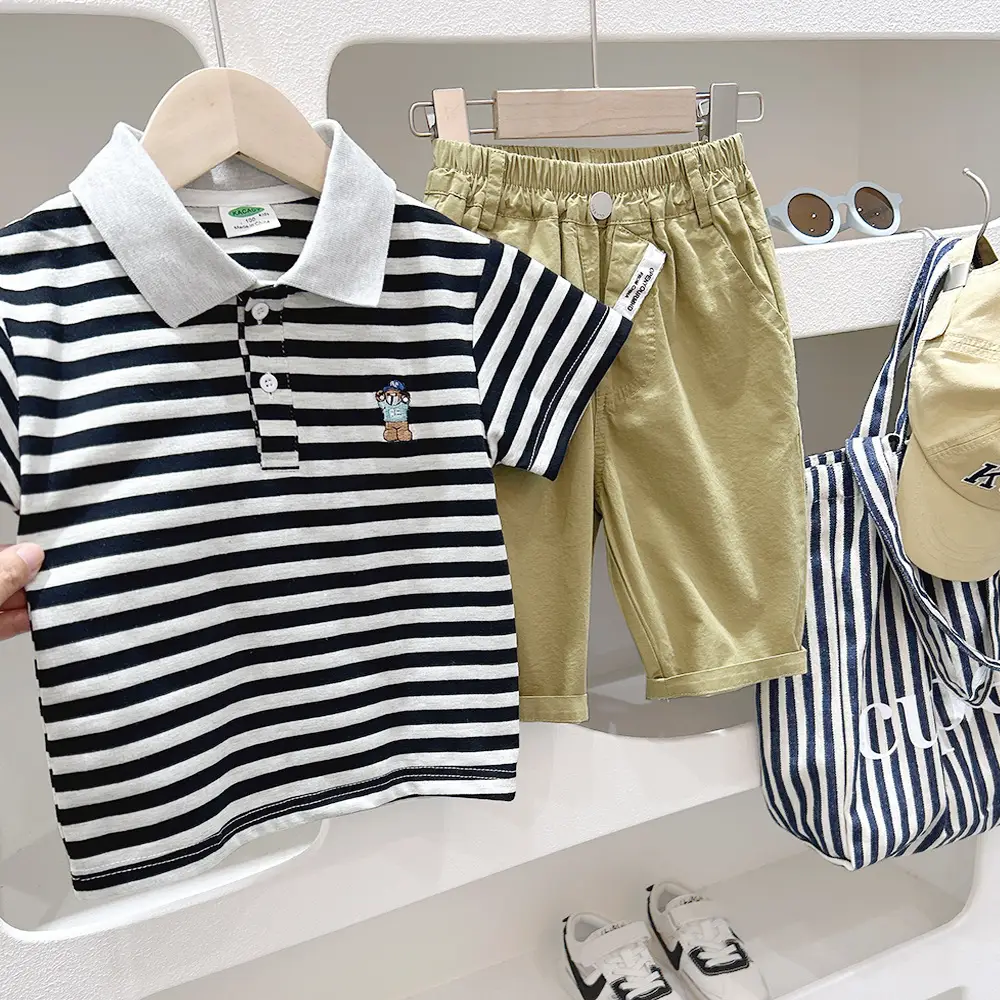 Boys White Polo Shirt with Cartoon Logo Medium to XL - Image 5