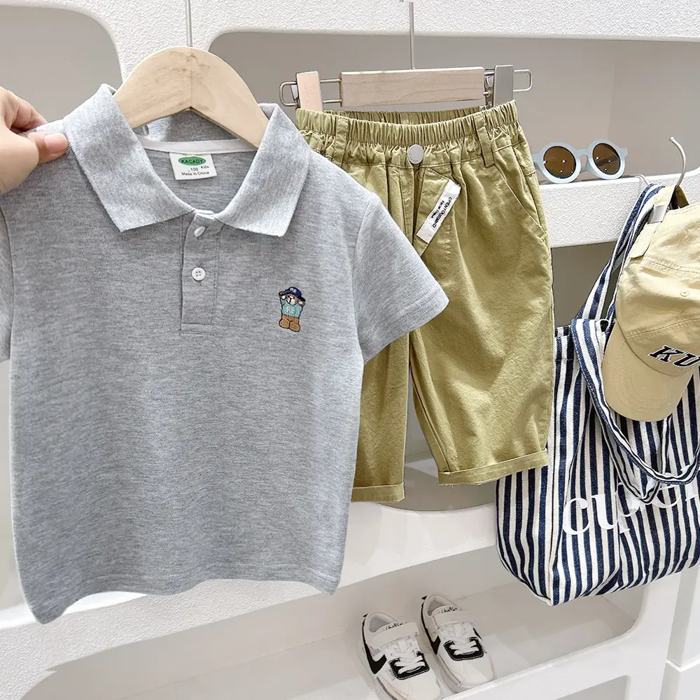 Boys White Polo Shirt with Cartoon Logo Medium to XL - Image 6