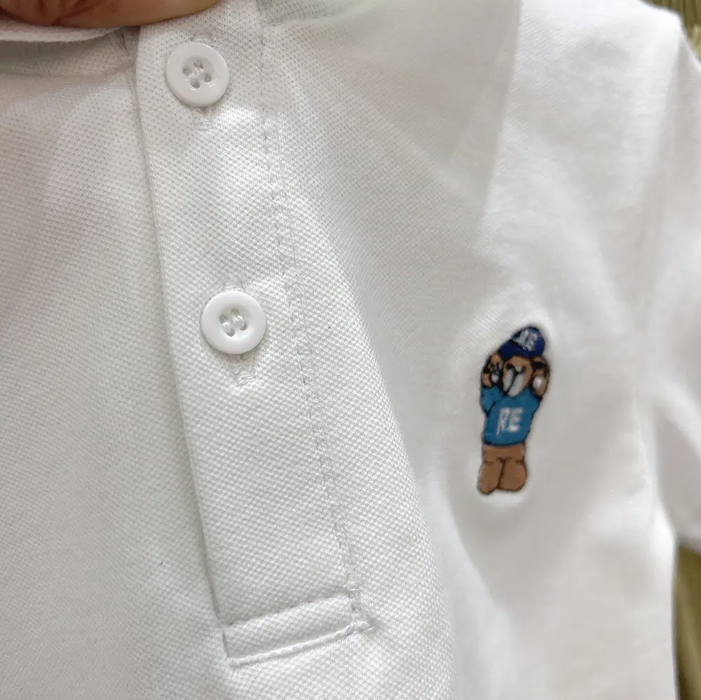 Boys White Polo Shirt with Cartoon Logo Medium to XL — feature 12