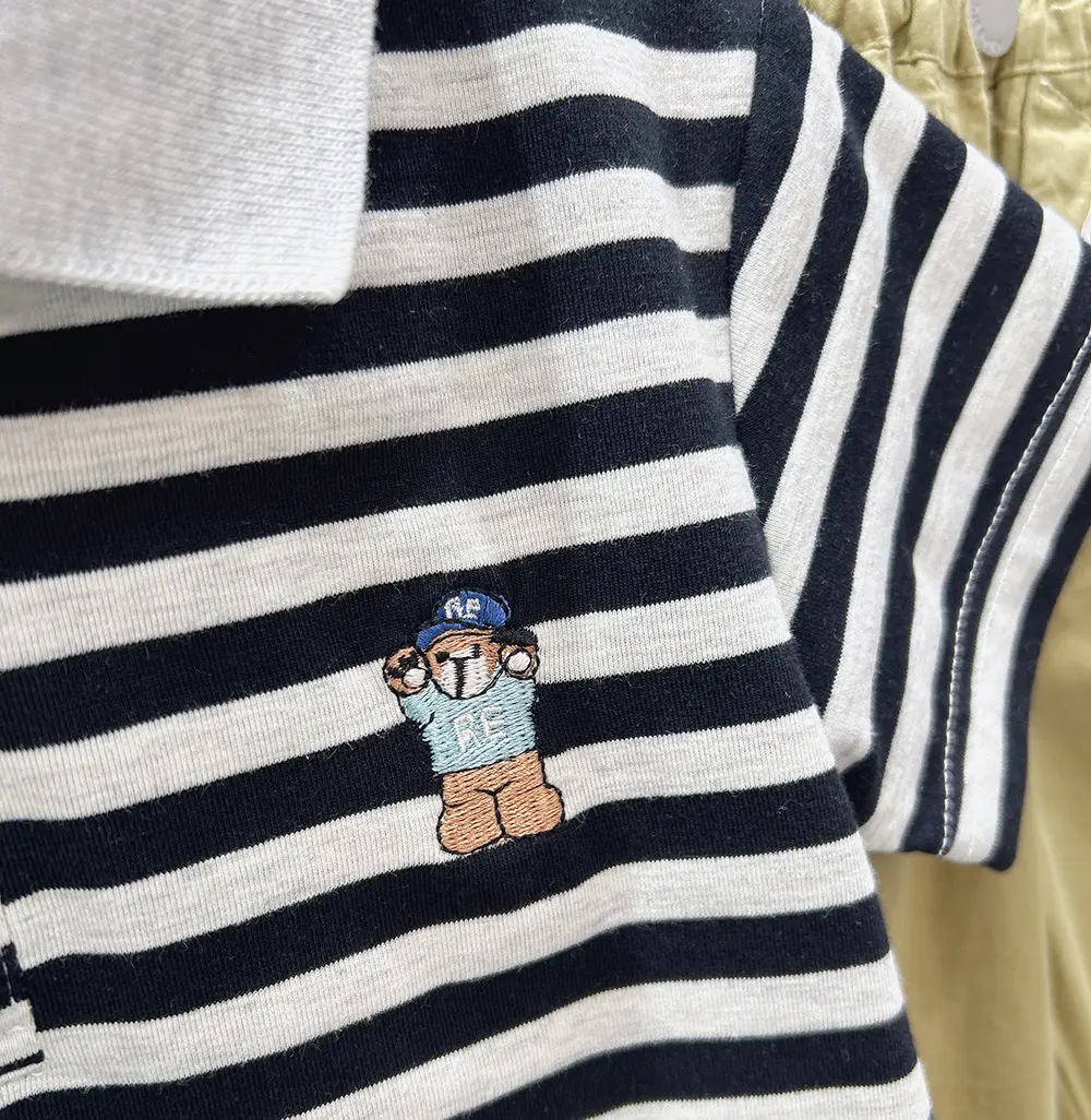 Boys White Polo Shirt with Cartoon Logo Medium to XL — feature 6