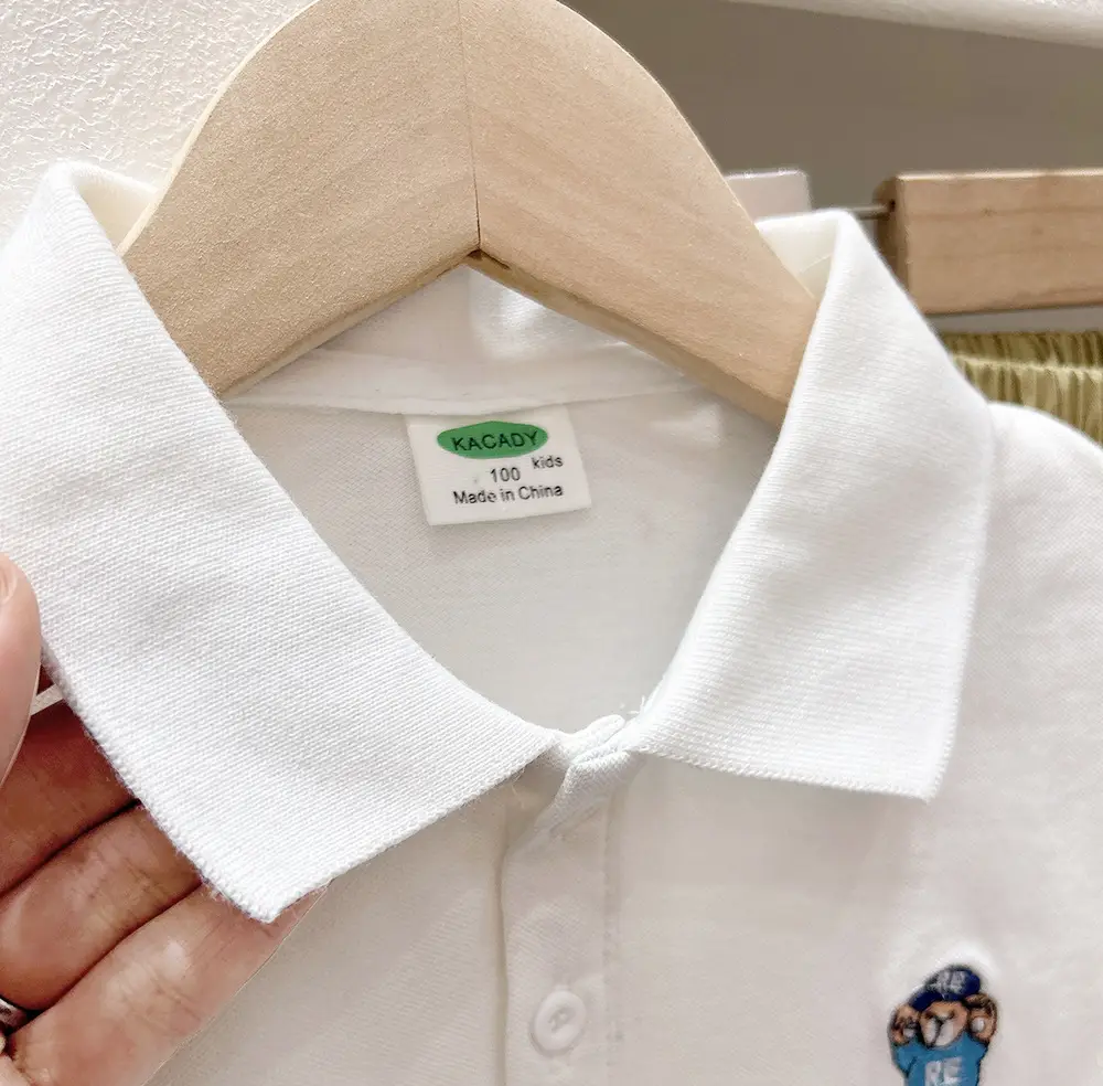 Boys White Polo Shirt with Cartoon Logo Medium to XL — feature 8