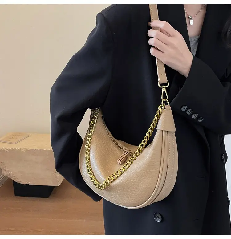 Women's tan chain bag with gold strap and crescent design — feature 10