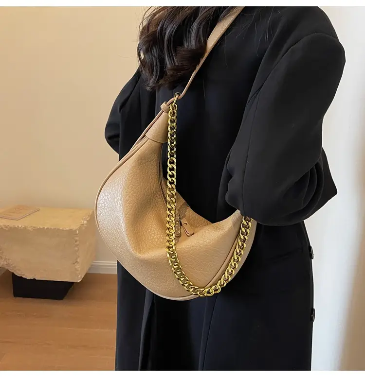 Women's tan chain bag with gold strap and crescent design — feature 11