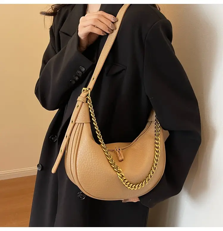 Women's tan chain bag with gold strap and crescent design — feature 12