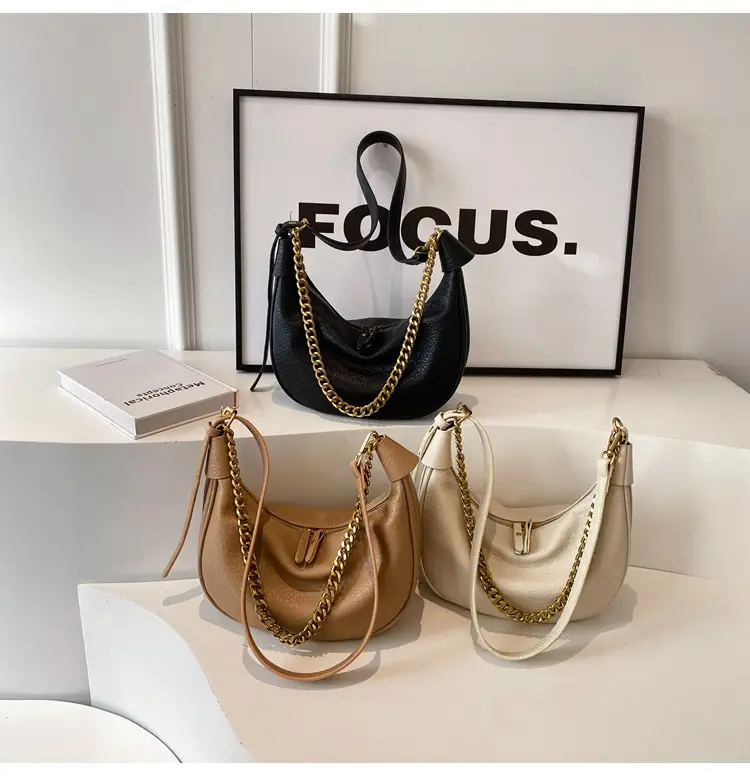 Women's tan chain bag with gold strap and crescent design — feature 19