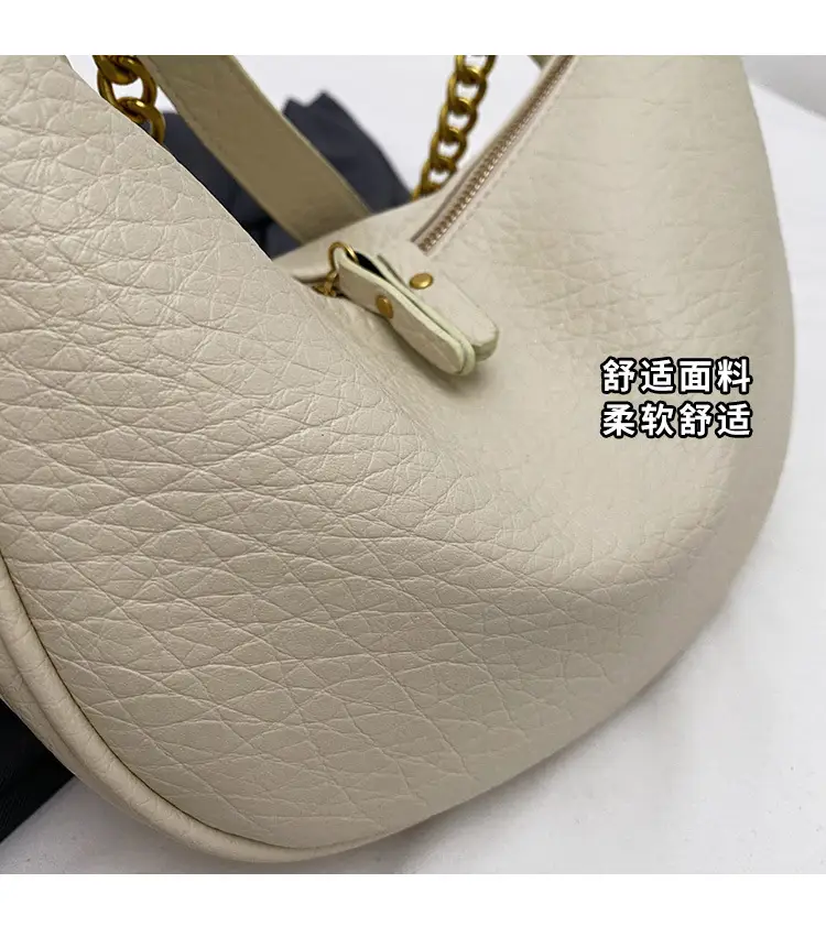 Women's tan chain bag with gold strap and crescent design — feature 2