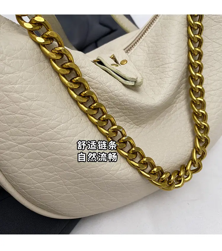Women's tan chain bag with gold strap and crescent design — feature 3