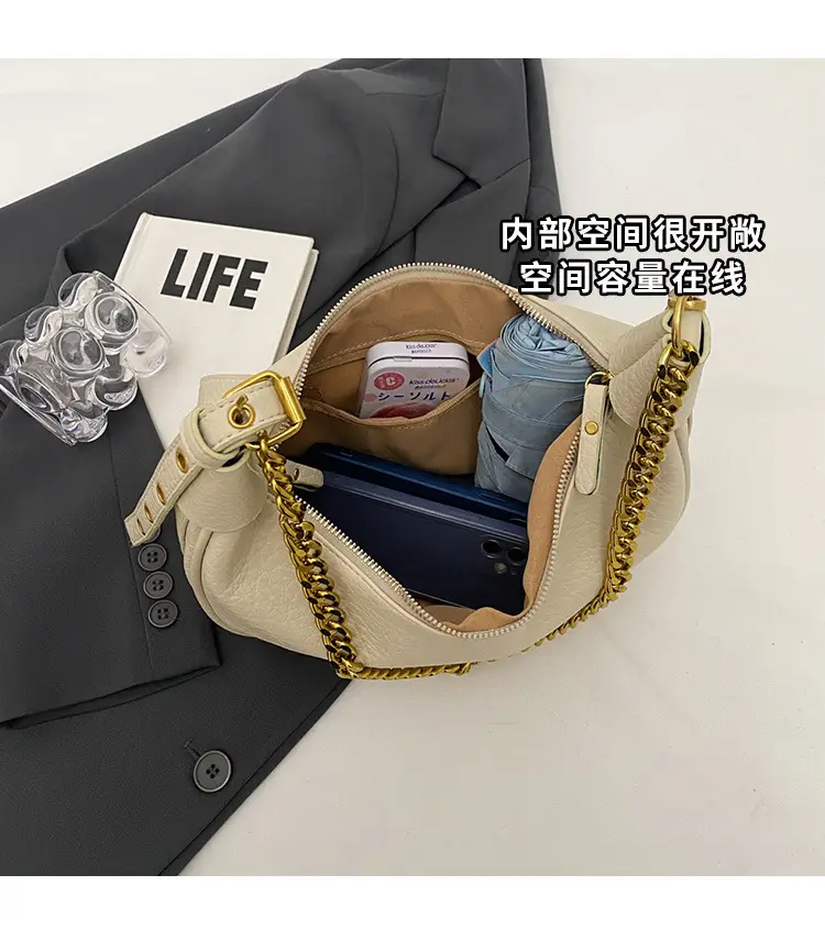Women's tan chain bag with gold strap and crescent design — feature 6