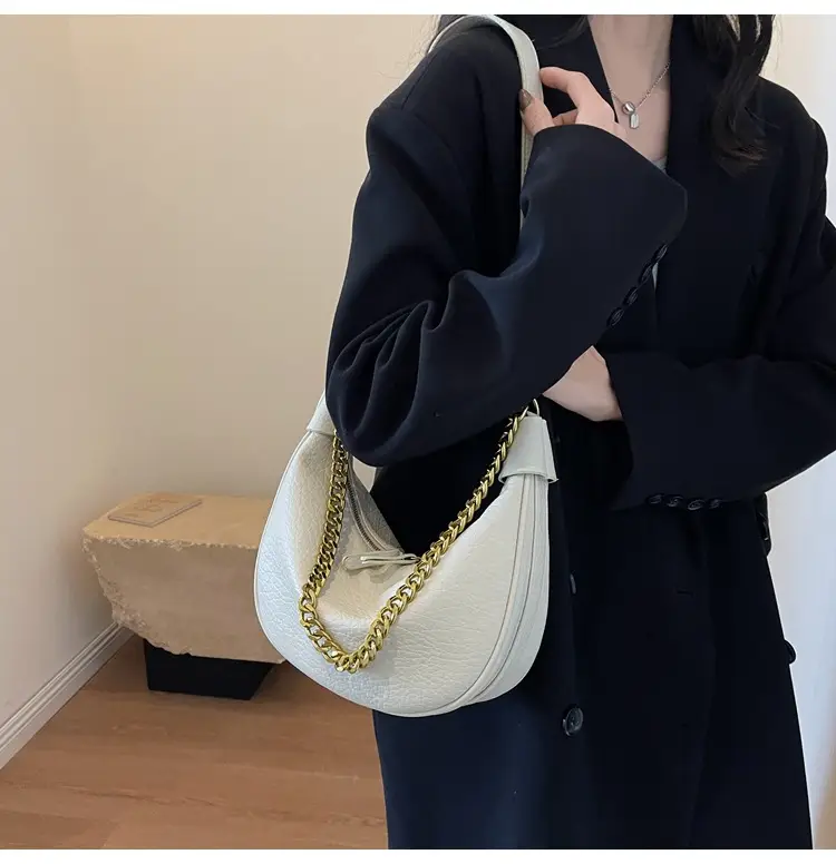 Women's tan chain bag with gold strap and crescent design — feature 7