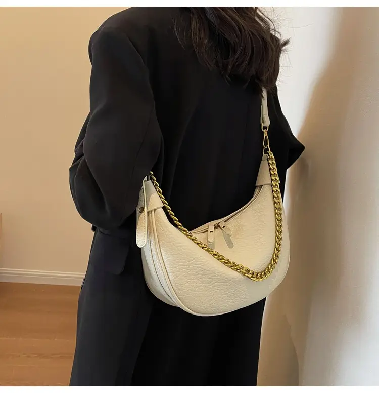 Women's tan chain bag with gold strap and crescent design — feature 8