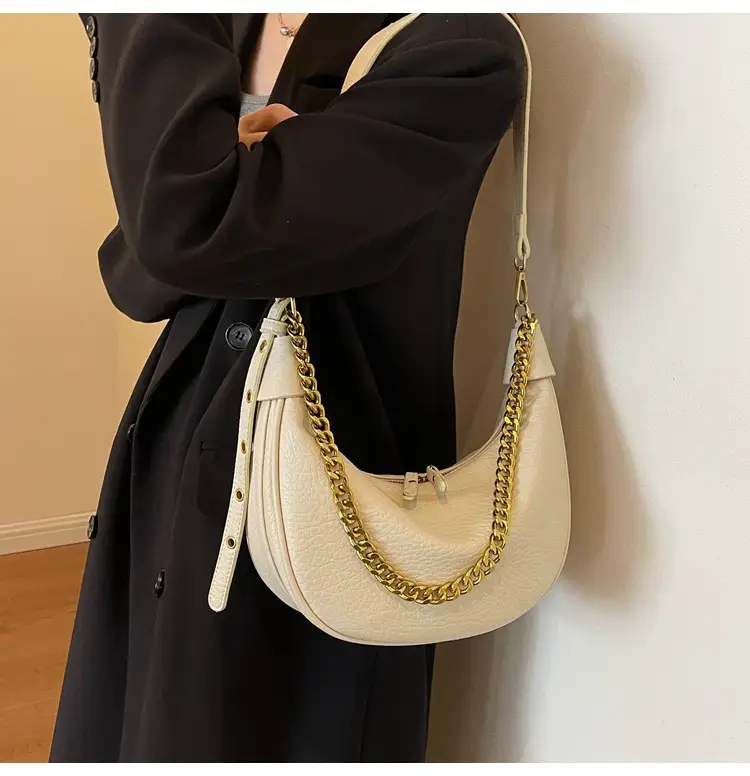Women's tan chain bag with gold strap and crescent design — feature 9