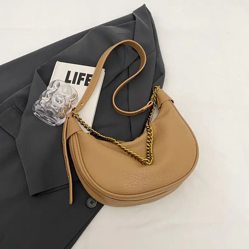Women's tan chain bag with gold strap and crescent design - Image 2