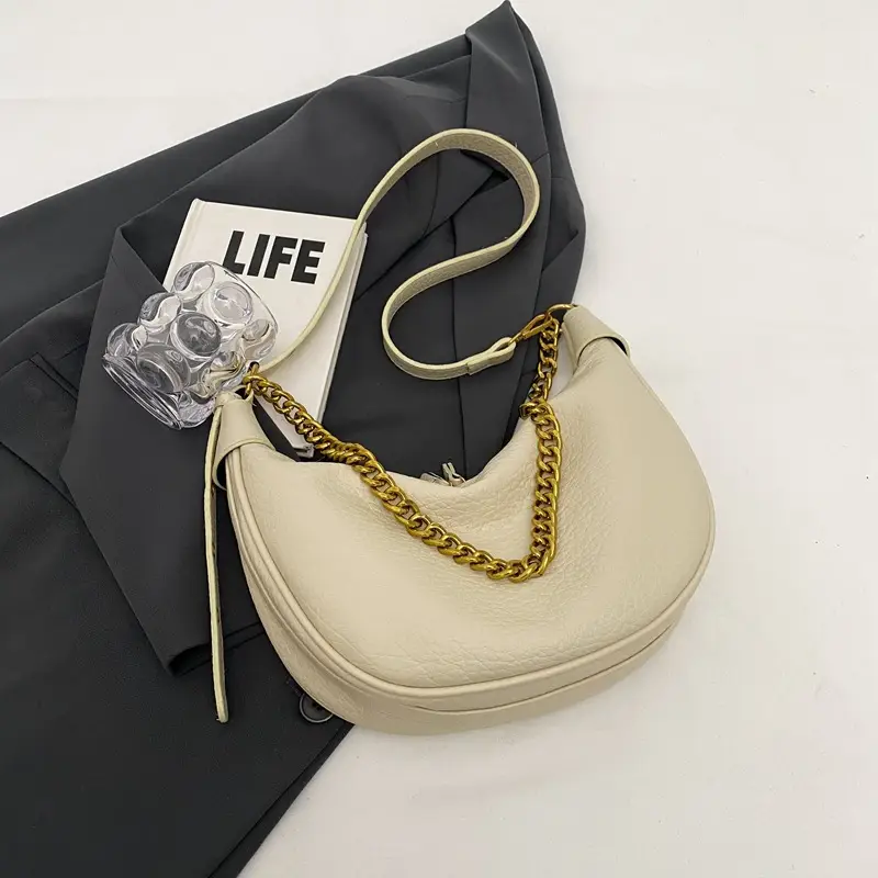 Women's tan chain bag with gold strap and crescent design - Image 3