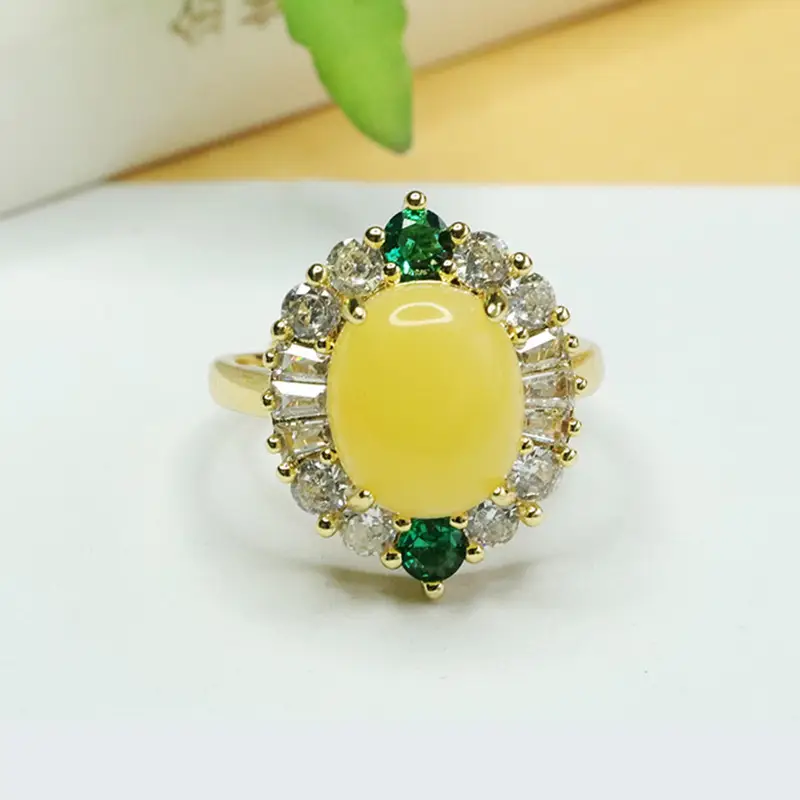 Aiyu Yellow Amber Ring with Green Emeralds — feature 1