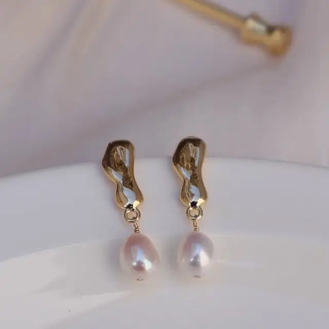 Gold Plated Pearl Earrings with Hammer Design - Image 2