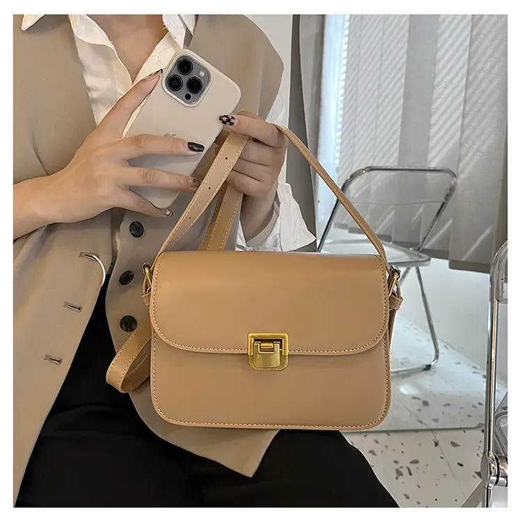 White Leather Crossbody Bag with Gold Clasp — feature 19