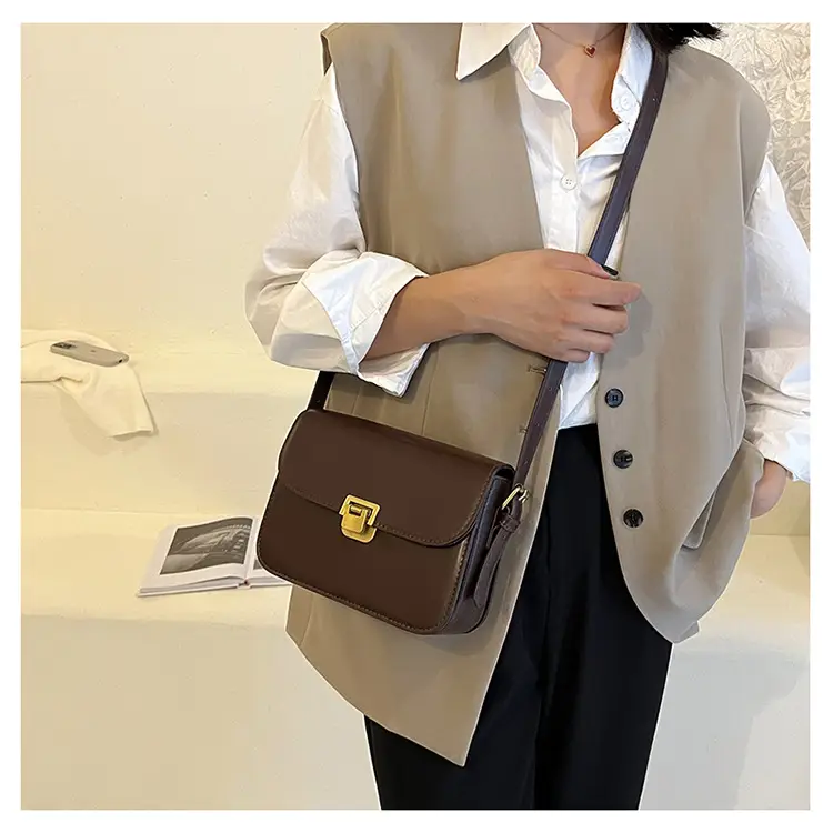 White Leather Crossbody Bag with Gold Clasp — feature 20