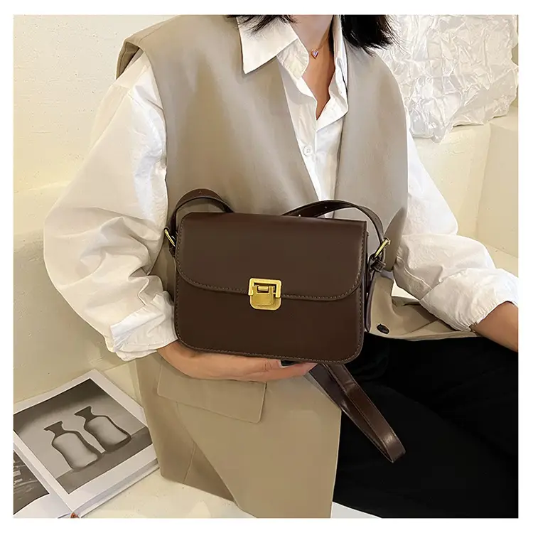 White Leather Crossbody Bag with Gold Clasp — feature 22