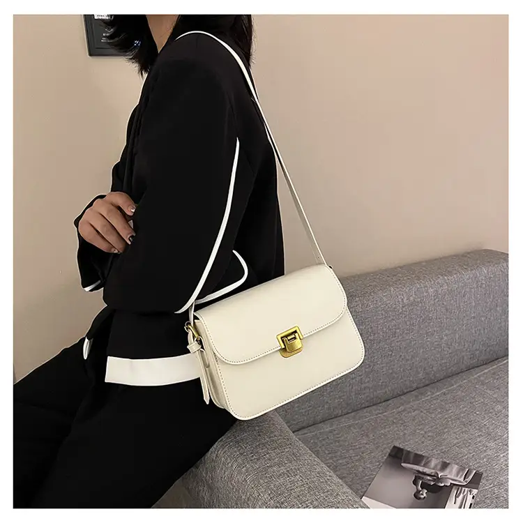 White Leather Crossbody Bag with Gold Clasp — feature 23