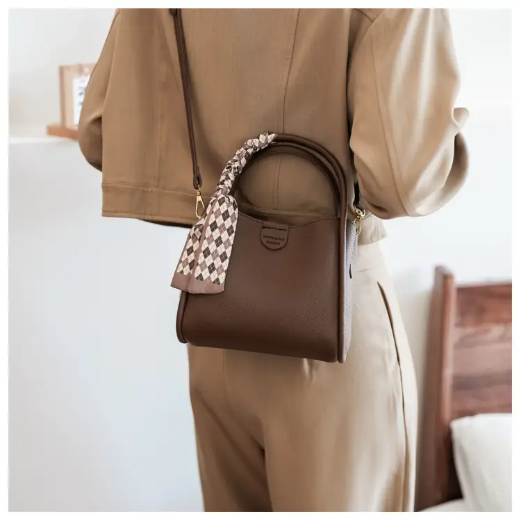 Women's Brown Leather Bucket Bag with Bow Handle — feature 19