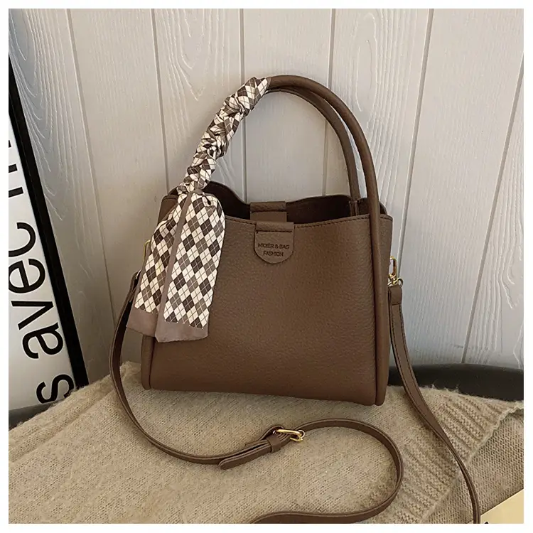 Women's Brown Leather Bucket Bag with Bow Handle — feature 23