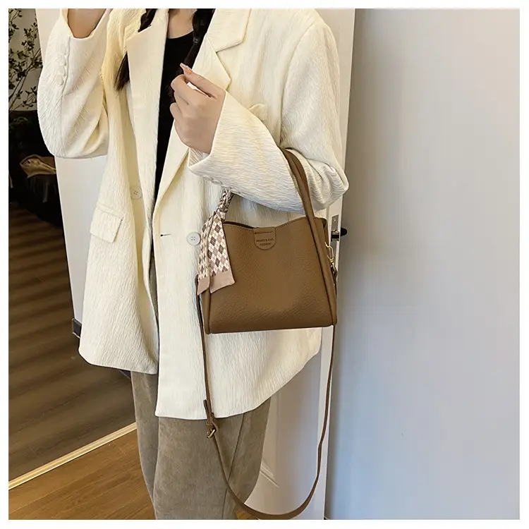 Women's Brown Leather Bucket Bag with Tassel Handle — feature 11