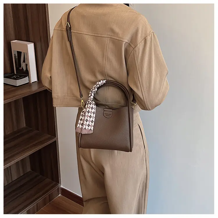 Women's Brown Leather Bucket Bag with Tassel Handle — feature 13