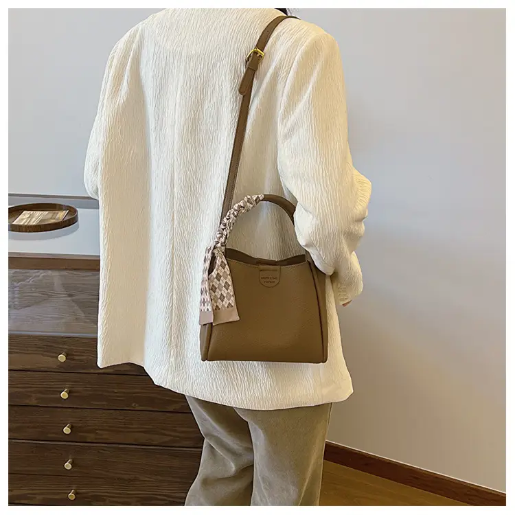Women's Brown Leather Bucket Bag with Tassel Handle — feature 9