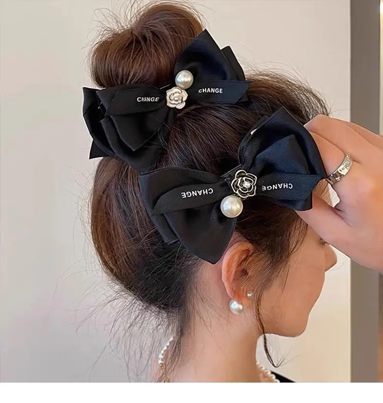 French Camellia Hairpin Black White Pearl Bow Updo — feature 1