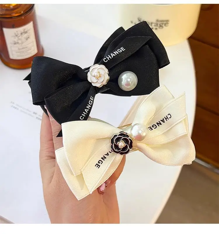 French Camellia Hairpin Black White Pearl Bow Updo — feature 5