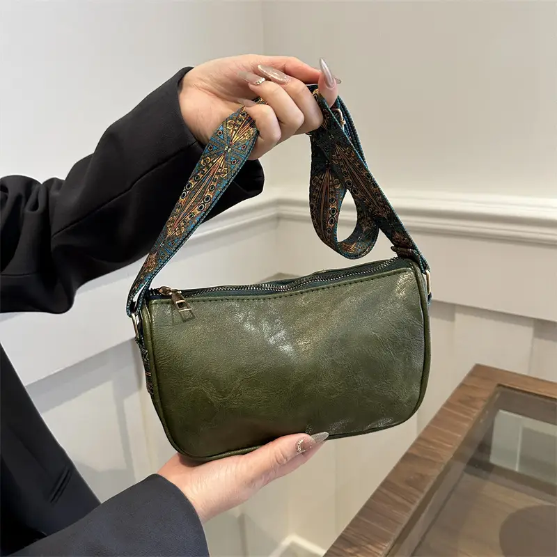 Green Leather Crossbody Bag with Patterned Strap