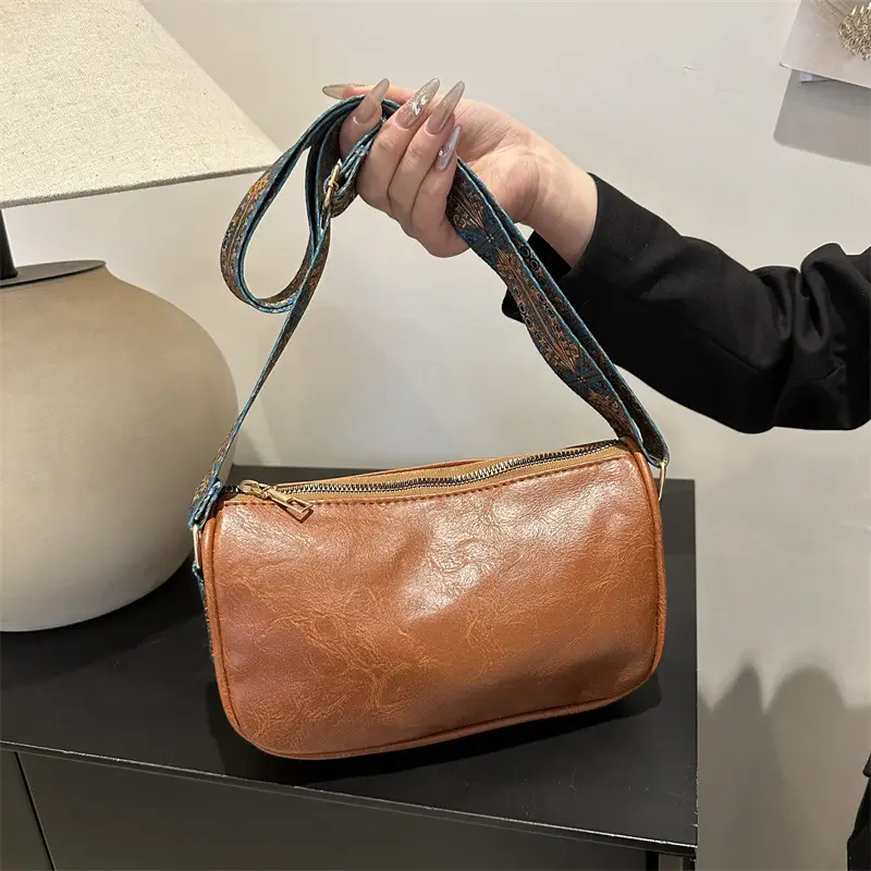 Green Leather Crossbody Bag with Patterned Strap