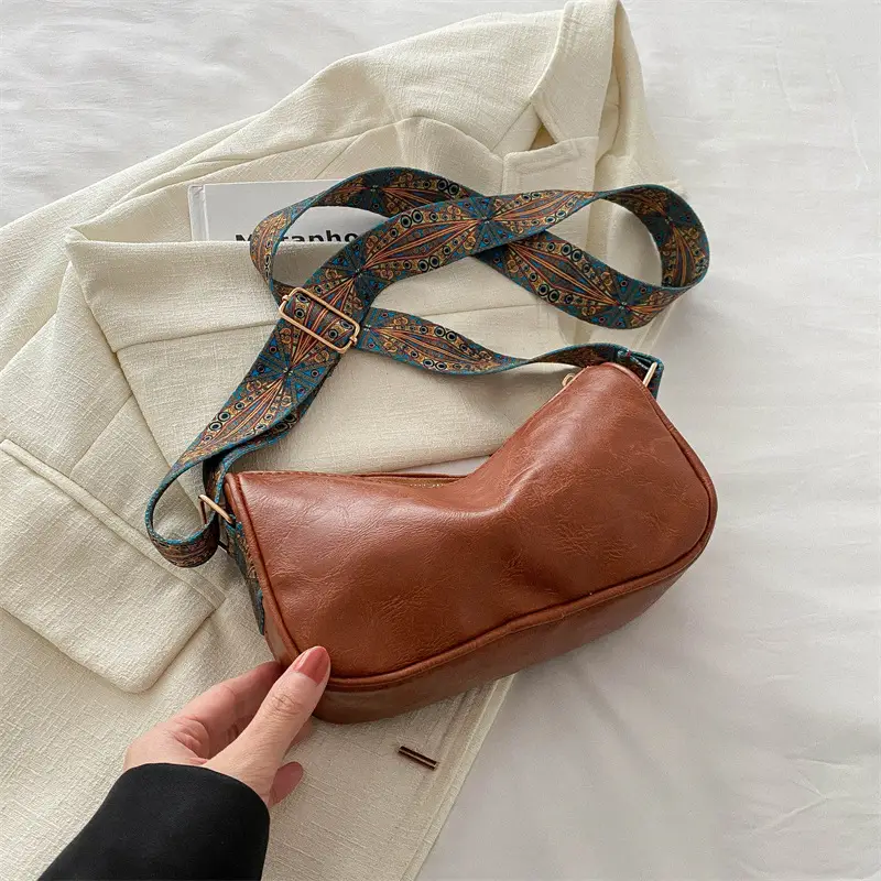 Green Leather Crossbody Bag with Patterned Strap