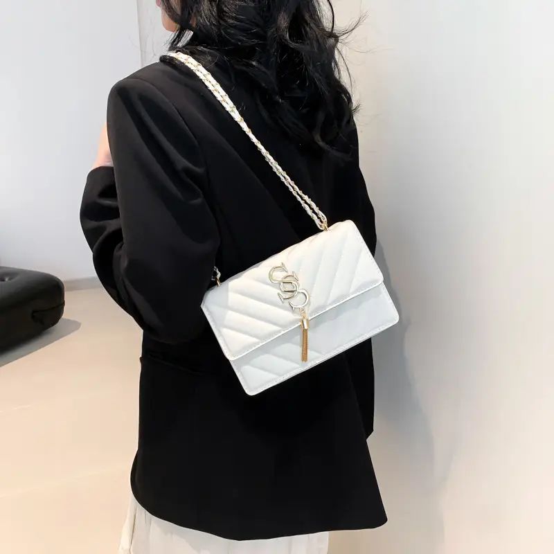 Women's tan quilted shoulder bag with chain strap - Image 6