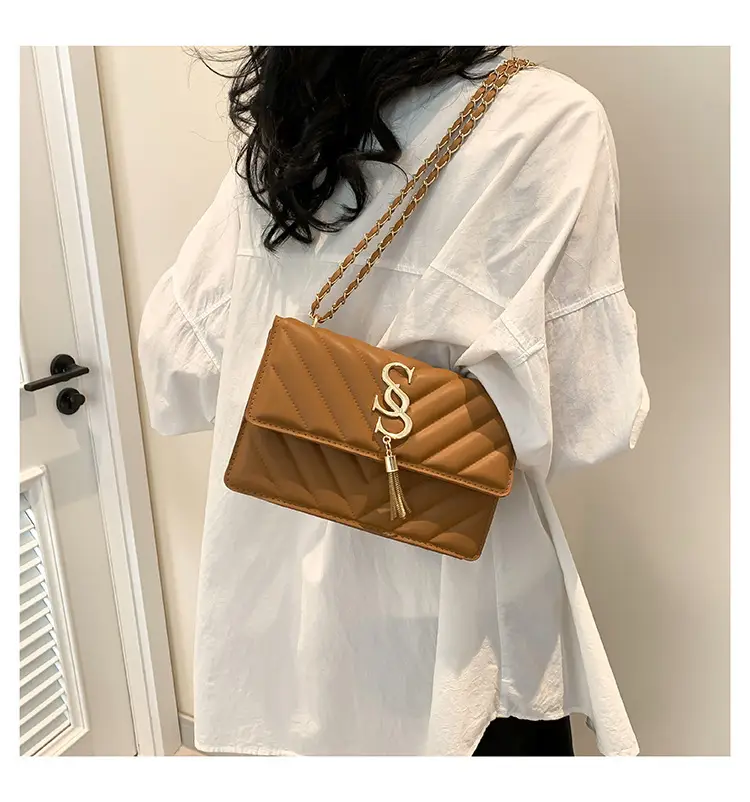 Women's tan quilted shoulder bag with chain strap — feature 10