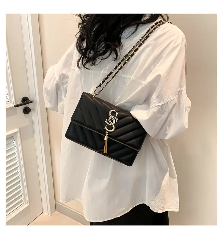 Women's tan quilted shoulder bag with chain strap — feature 11