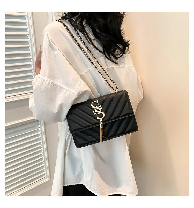 Women's tan quilted shoulder bag with chain strap — feature 12