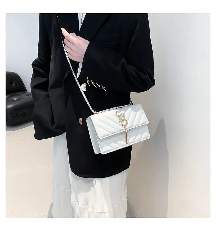 Women's tan quilted shoulder bag with chain strap — feature 15