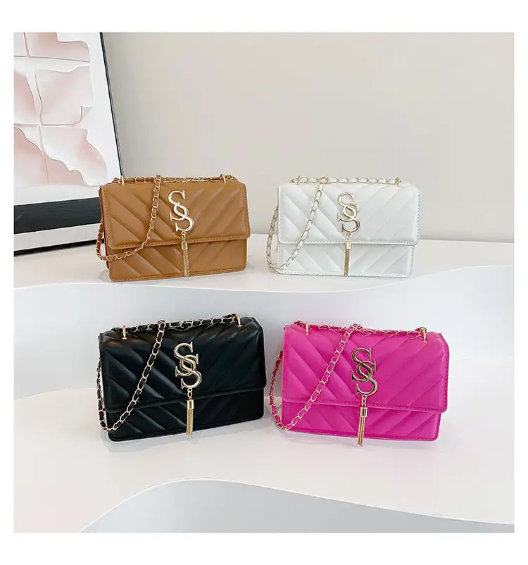 Women's tan quilted shoulder bag with chain strap — feature 25