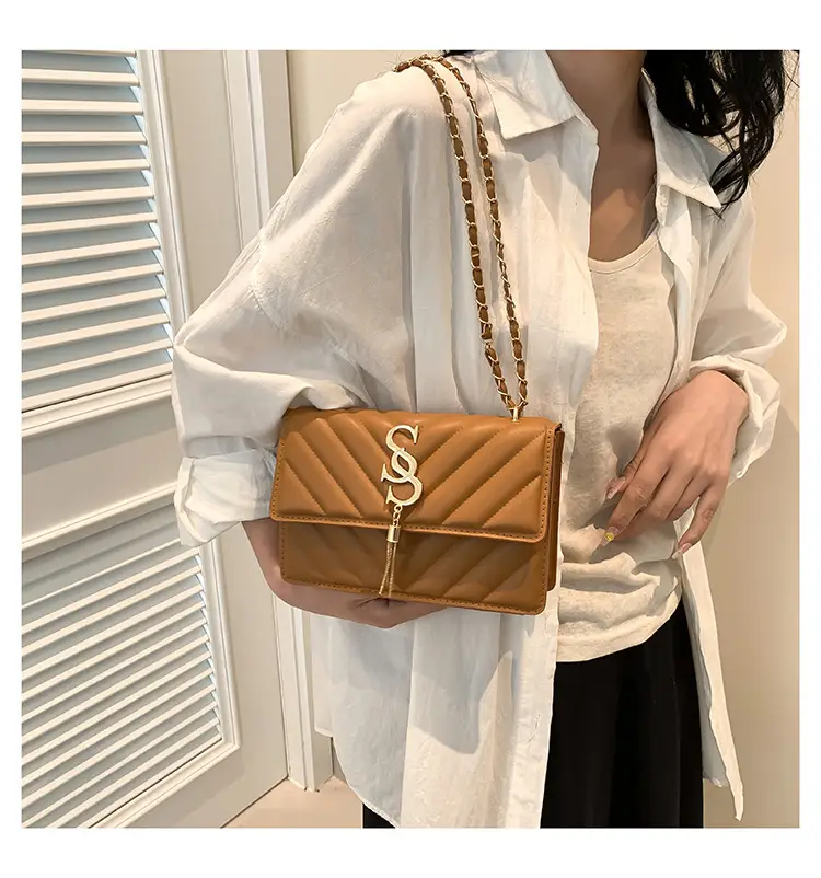 Women's tan quilted shoulder bag with chain strap — feature 9