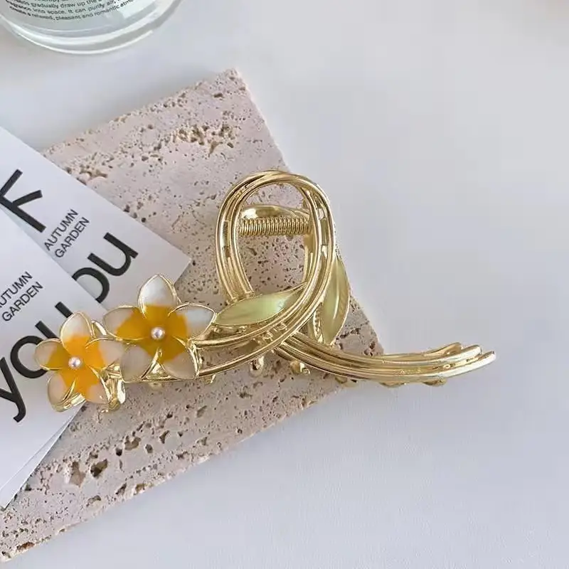 Golden Daisy Hairpin with Green Leaf Design - Image 6