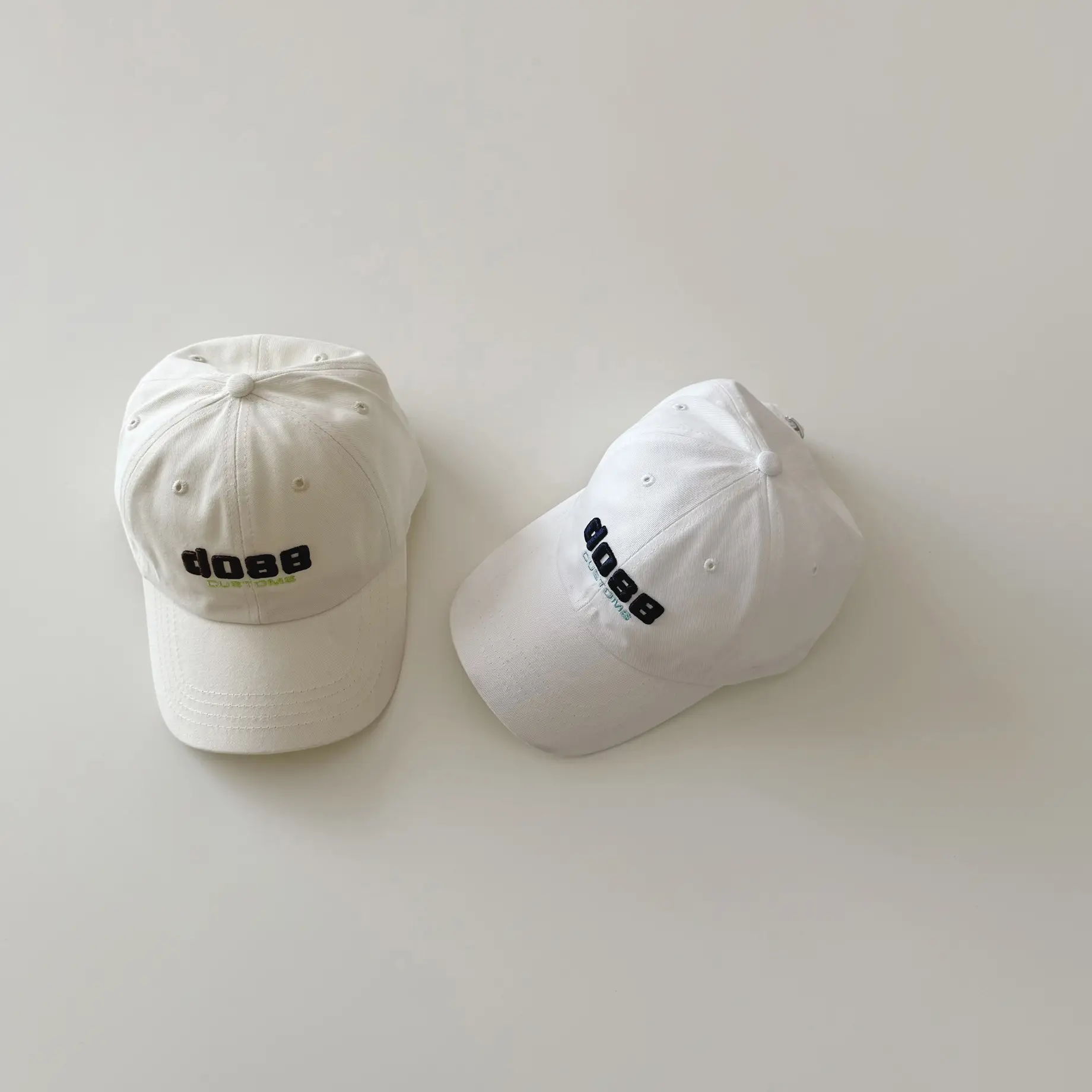White Embroidered Baby Cap with "Yipan" Logo - Image 5