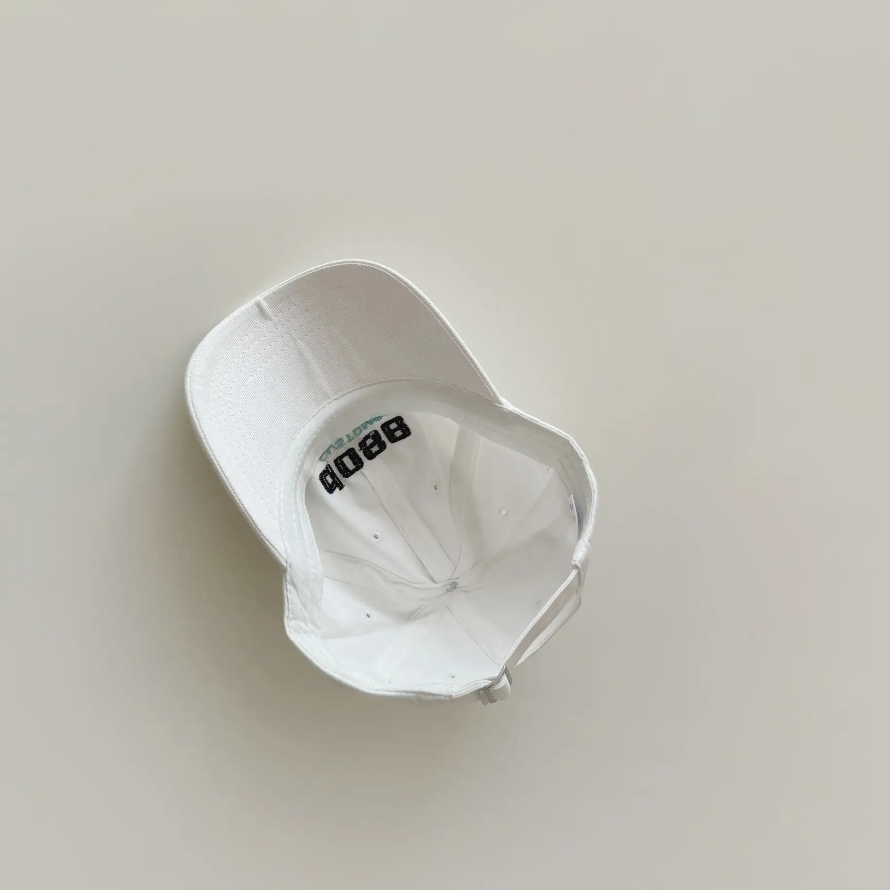 White Embroidered Baby Cap with "Yipan" Logo - Image 7
