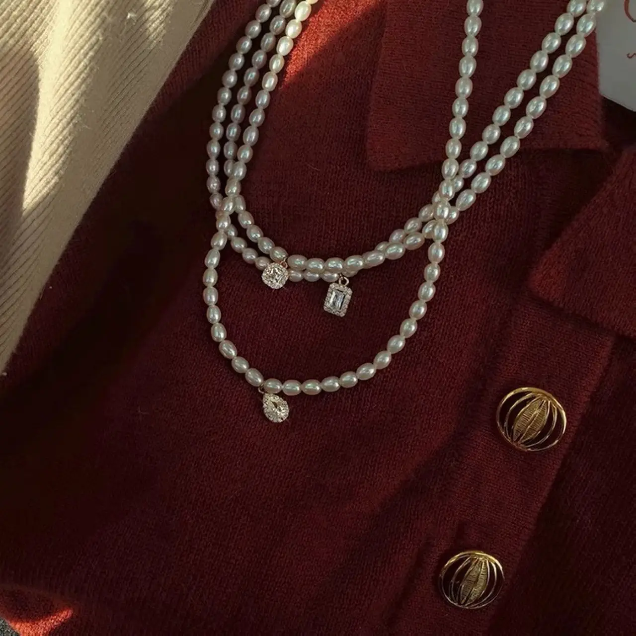 Women's Pearl Collarbone Necklace with Red Sweater - Image 2