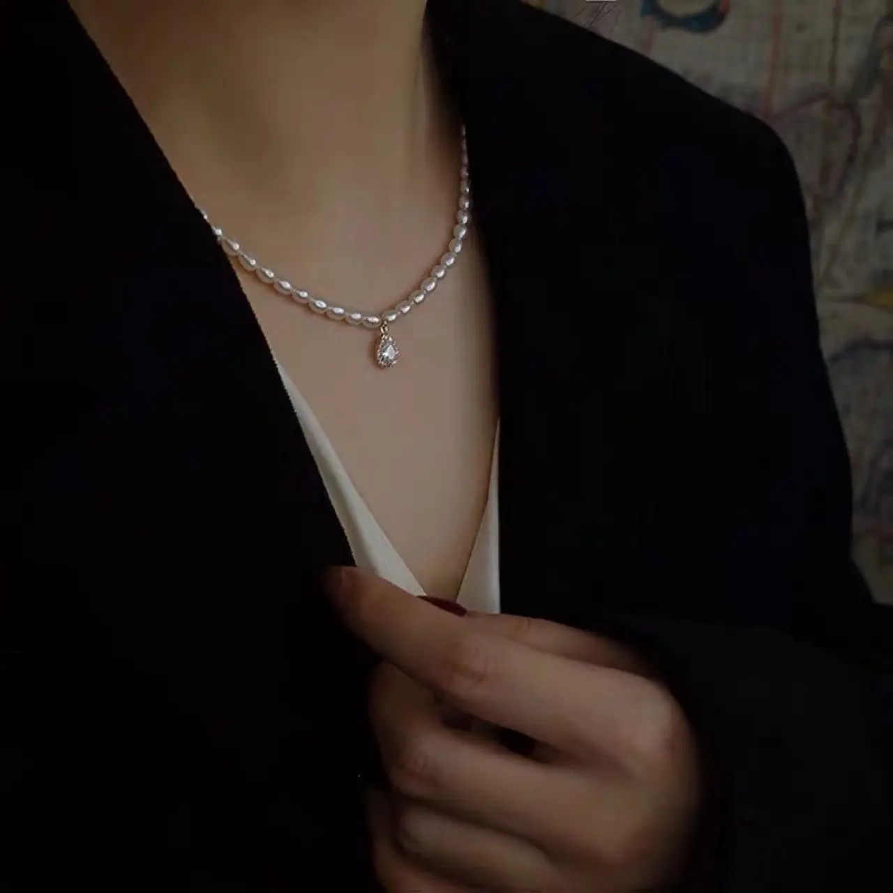 Women's Pearl Collarbone Necklace with Red Sweater - Image 3