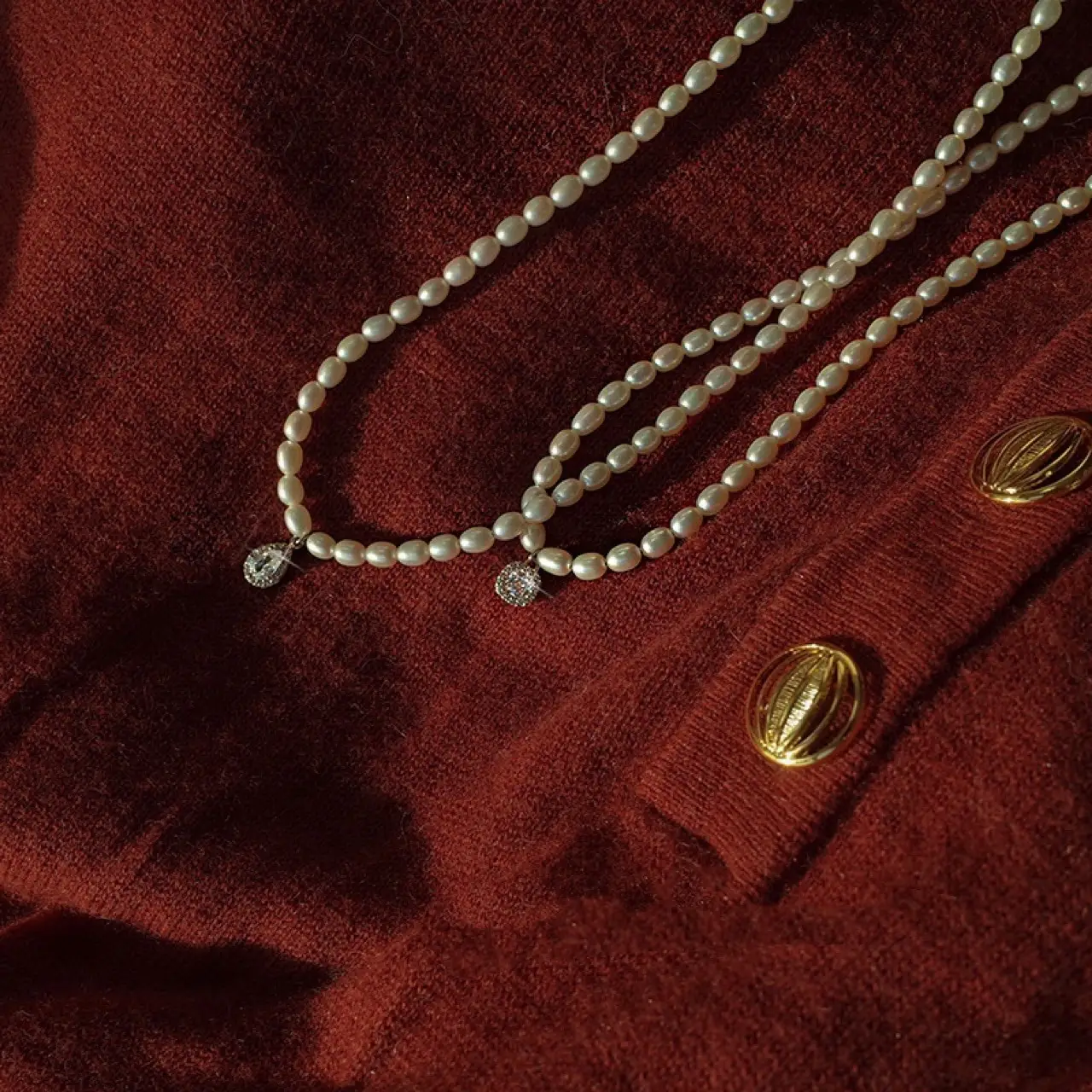 Women's Pearl Collarbone Necklace with Red Sweater - Image 4