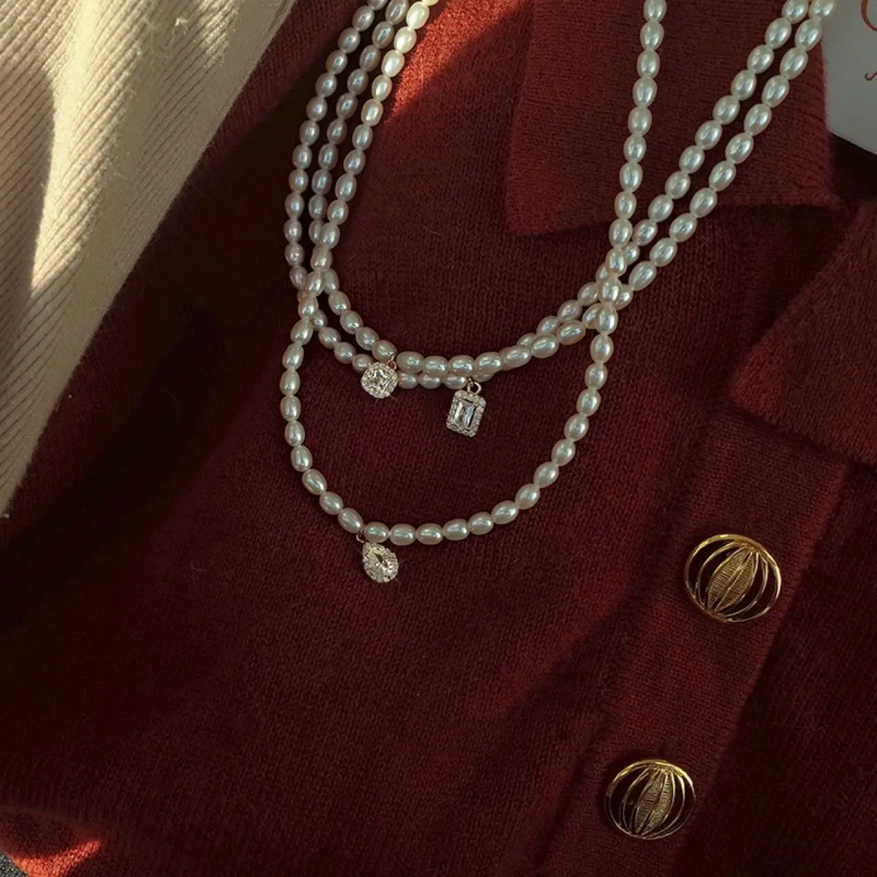 Women's Pearl Collarbone Necklace with Red Sweater — feature 4