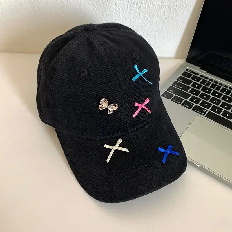 Black Knitted Bow Cap with Multi Color X Embroidery - Image 3